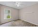 Bright bedroom with carpet, ceiling fan, and natural light at 7302 Sunshine Bridge Ave, Gibsonton, FL 33534