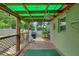 Enclosed patio area with wood floors and fan at 7302 Sunshine Bridge Ave, Gibsonton, FL 33534