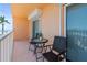 Cozy balcony with seating offers a serene space to enjoy the view at 7432 Sunshine Skyway S Ln # 402, St Petersburg, FL 33711
