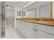 Bathroom featuring double sinks and granite countertops at 7432 Sunshine Skyway S Ln # 402, St Petersburg, FL 33711