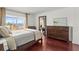 Bedroom with hardwood floors and a balcony with a water view at 7432 Sunshine Skyway S Ln # 402, St Petersburg, FL 33711