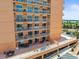 Exterior shot of a multi-story condo building showing the parking area at 7432 Sunshine Skyway S Ln # 402, St Petersburg, FL 33711