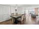 Stylish dining area featuring wood floors, a modern table, and water views at 7432 Sunshine Skyway S Ln # 402, St Petersburg, FL 33711