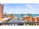 Water view from the building with a pool, beach and parking spaces at 7432 Sunshine Skyway S Ln # 402, St Petersburg, FL 33711