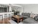 Open-concept living room with hardwood floors and breakfast bar, perfect for modern living at 7432 Sunshine Skyway S Ln # 402, St Petersburg, FL 33711