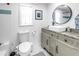 Bathroom featuring updated vanity, toilet, shower, and bright natural light at 750 49Th N Ave, St Petersburg, FL 33703