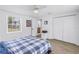 Comfortable bedroom with a view into the bathroom, closet, and light wood flooring at 750 49Th N Ave, St Petersburg, FL 33703