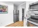 Conveniently located laundry closet featuring stacked washer and dryer and ample space for a refrigerator at 750 49Th N Ave, St Petersburg, FL 33703
