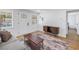 Bright living room features wood floors, comfortable seating, and a seamless transition into the adjacent rooms at 750 49Th N Ave, St Petersburg, FL 33703
