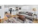 Bright and airy living room flows into a modern kitchen, featuring wood floors and stylish decor at 750 49Th N Ave, St Petersburg, FL 33703