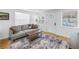 Inviting living room featuring wood floors, a comfortable sofa, and ample natural light at 750 49Th N Ave, St Petersburg, FL 33703