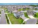 Scenic aerial of home featuring lush landscaping, pond views, and the vibrant community at 7628 Surf Reed Way, Wesley Chapel, FL 33545
