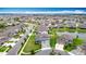 Expansive aerial view of a residential community featuring beautiful homes and scenic ponds at 7628 Surf Reed Way, Wesley Chapel, FL 33545