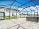 Enjoy this private outdoor area with screened enclosure and hot tub at 7628 Surf Reed Way, Wesley Chapel, FL 33545