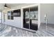 Relax and unwind on this screened patio with bar and TV at 7628 Surf Reed Way, Wesley Chapel, FL 33545