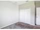 A bedroom featuring carpeted floors, a standard closet, and neutral paint at 7628 Surf Reed Way, Wesley Chapel, FL 33545