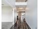 Welcoming foyer with soaring ceilings, hardwood floors and staircase leading to the upper level at 7628 Surf Reed Way, Wesley Chapel, FL 33545
