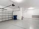 Spacious two car garage with epoxy floor and garage door opener at 7628 Surf Reed Way, Wesley Chapel, FL 33545