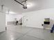Spacious two car garage with epoxy floor and access door at 7628 Surf Reed Way, Wesley Chapel, FL 33545