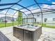 Enjoy this private hot tub in a screened in back patio at 7628 Surf Reed Way, Wesley Chapel, FL 33545