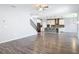 Bright living area showcasing the kitchen, wood floors, and open layout at 7628 Surf Reed Way, Wesley Chapel, FL 33545