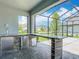 Entertain on this screened patio with a custom outdoor kitchen at 7628 Surf Reed Way, Wesley Chapel, FL 33545