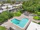 Enjoy community amenities with an L-shaped pool, lounging areas, surrounded by nature at 801 Russell Ln # 252, Brandon, FL 33510