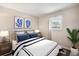 Cozy bedroom featuring nautical-themed decor, crisp white linens and a sunlit window at 801 Russell Ln # 252, Brandon, FL 33510