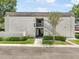 Charming building featuring stairs leading to units, and well-maintained landscaping at 801 Russell Ln # 252, Brandon, FL 33510