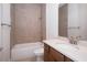 Bathroom featuring a single sink vanity, tile flooring, and a shower and tub combo at 8834 Sanders Tree Loop, Wesley Chapel, FL 33545