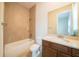 Bathroom featuring a single sink vanity, tile flooring, and a shower and tub combo at 8834 Sanders Tree Loop, Wesley Chapel, FL 33545