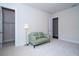 Bright bedroom features plush carpet, neutral walls, and a walk-in closet at 8834 Sanders Tree Loop, Wesley Chapel, FL 33545