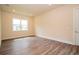 Bedroom featuring wood flooring, neutral walls, and natural light at 8834 Sanders Tree Loop, Wesley Chapel, FL 33545