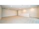 Spacious bonus room with neutral walls and carpet, recessed lights, and access to the upper level at 8834 Sanders Tree Loop, Wesley Chapel, FL 33545