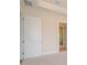 Hallway with views to the bathroom and open doorway at 8834 Sanders Tree Loop, Wesley Chapel, FL 33545