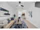 Inviting living room with a ceiling fan, plush seating, and an open layout at 8856 Christie Dr # 0, Largo, FL 33771