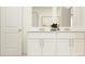 Modern bathroom with double vanity, contemporary fixtures and design at 9332 Cannon Beach Dr, Parrish, FL 34219