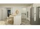 Contemporary kitchen featuring white cabinetry, stainless steel appliances, and a center island with barstool seating at 9456 Gladsome Dr, Land O Lakes, FL 34637