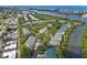 Aerial view showcasing the community's waterfront location with lush landscaping at 9722 Indian Key Trl # 116, Seminole, FL 33776