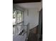 Balcony with railings, stairs and views of trees at 9722 Indian Key Trl # 116, Seminole, FL 33776