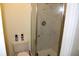 Bathroom showing a glass shower and tile walls at 9722 Indian Key Trl # 116, Seminole, FL 33776