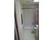 Accessible bathroom with a walk-in shower and safety bars next to the toilet at 9722 Indian Key Trl # 116, Seminole, FL 33776