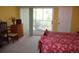 Bedroom featuring natural light, a private balcony, and a chest of drawers at 9722 Indian Key Trl # 116, Seminole, FL 33776