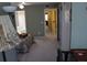 Cozy bedroom features neutral carpeting, en suite bathroom, and convenient access to hallway at 9722 Indian Key Trl # 116, Seminole, FL 33776