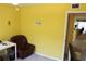 Bright bedroom featuring a cozy chair and desk, perfect for a home office or quiet relaxation at 9722 Indian Key Trl # 116, Seminole, FL 33776