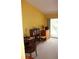 Bedroom with vaulted ceiling and sliding glass doors to screened balcony at 9722 Indian Key Trl # 116, Seminole, FL 33776