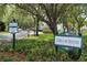 Tara Cay Sound community entrance sign with manicured landscaping at 9722 Indian Key Trl # 116, Seminole, FL 33776