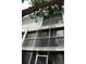 Low angle of screened patios and balconies, showcasing bright exteriors at 9722 Indian Key Trl # 116, Seminole, FL 33776