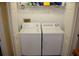 Convenient in-unit laundry closet with washer and dryer, offering a practical laundry solution at 9722 Indian Key Trl # 116, Seminole, FL 33776