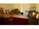 Comfortable living room with multiple seating areas and a bright red rug at 9722 Indian Key Trl # 116, Seminole, FL 33776